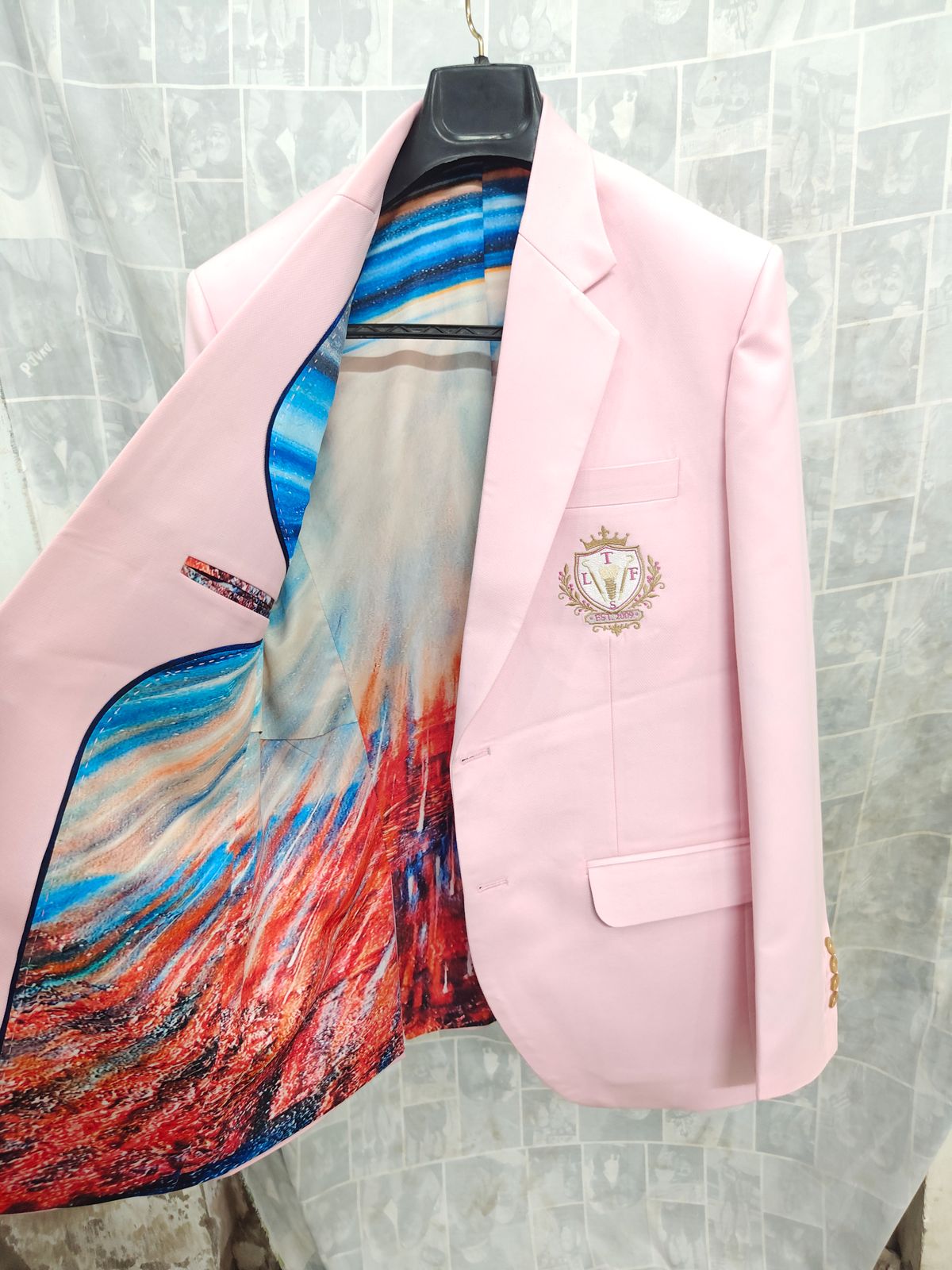 Pink custom blazer with colorful artistic printed lining and embroidered crest